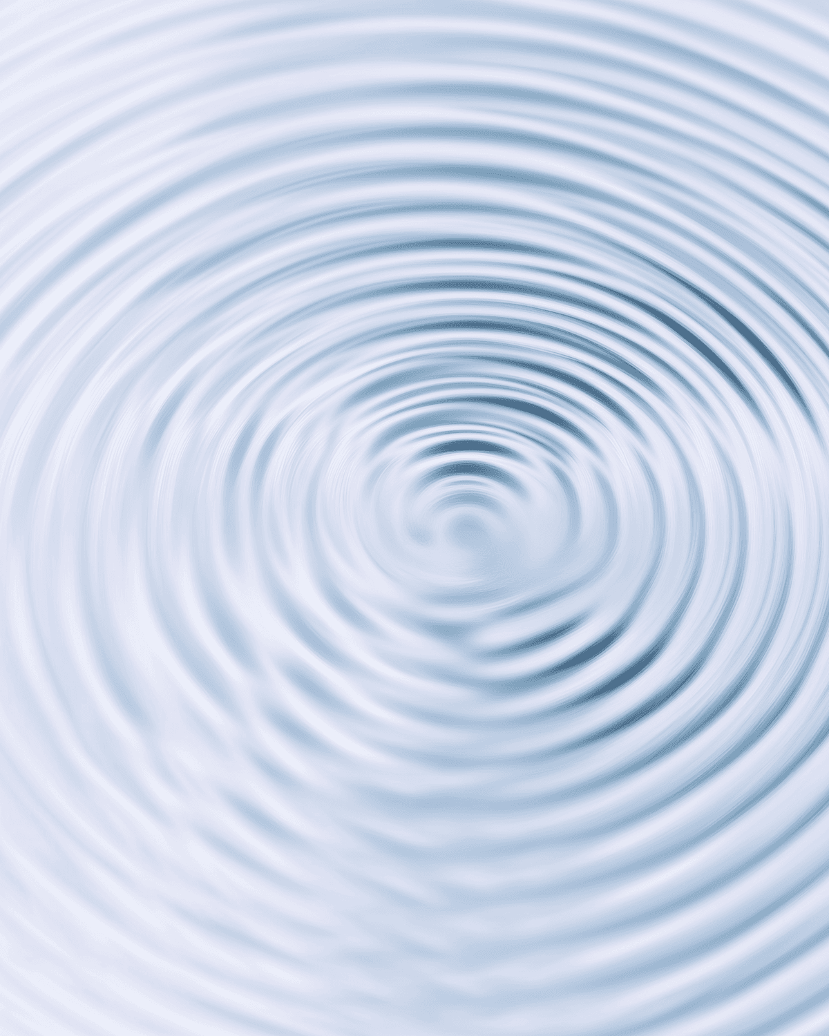 Concentric ripples spreading across a calm water surface
